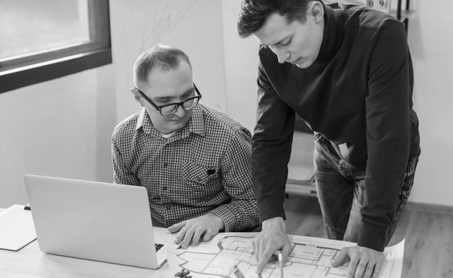 Person analyzing seasonal budget spreadsheet with quarterly comparison charts and expense tracking graphs